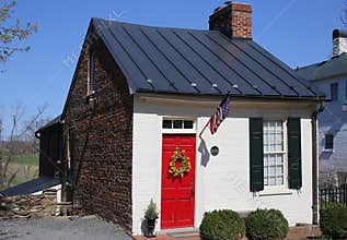 Old brick house with a red door