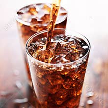 Soft drink being poured into glass
