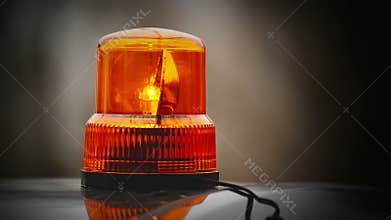 Flashing revolving light on top of a police, firemen, hospital emergency support and services vehicles