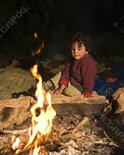 Boy at campfire