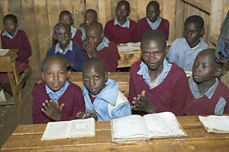 Karimba School with school children at their desk in classroom in North Kenya, Africa
