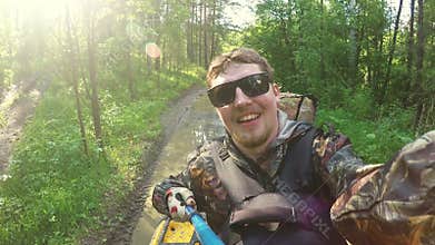 Two Man on ATV in forest video Selfe