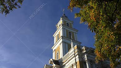 Church belfry and chestnut tree in autumn
