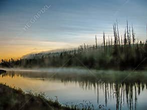 Mystic river with fog reflected