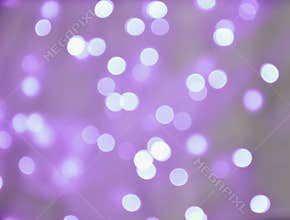 Abstract background purple bokeh circles.