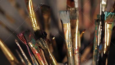 A lot of brushes of the artist in the rays of light. soft light from the window