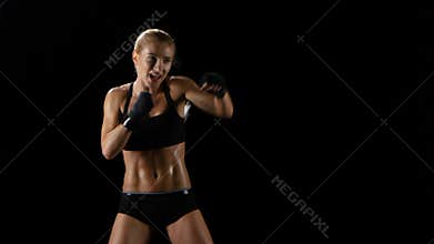 Sports training women boxer. Quick and precise blows