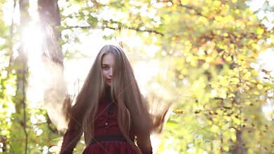 Young woman with long hair on a chic daytime nature