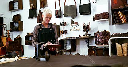 Craftswoman using digital tablet