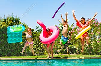 Joyful kids having fun during summer pool party