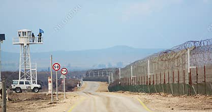 Border of Syria and Israel. Tall fences with military posts and UN soldiers