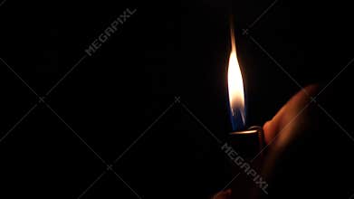 Flaming lighter in hands