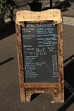 Tourist restaurant food menu on street