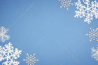 Pattern white snowflake on blue background. Christmas decor with Copy space