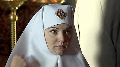 Church. Nuns in the service