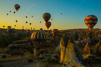 Travel to Goreme, Cappadocia, Turkey. The sunrise in the mountains with a lot of air hot balloons in the sky