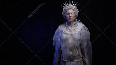 Body art of the Snow Queen with icicle crown and earrings