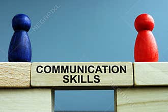 Communication skills written on a bridge from blocks