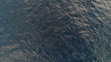 Top-down view of the sea waves. Sea ripples. Aerial view. The background of the sea. The texture of the water. Calm sea