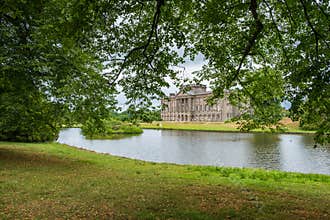 Lyme Hall and its pond inside Lyme Park in Cheshire, England.