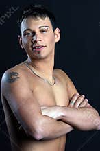 Young man with tattoo on arm