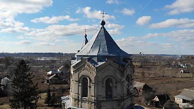 Aerial view of the old Catholic Church in Ukraine with pegeons near it