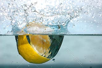 Lemon splash into water