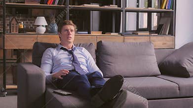 Football fan in apartment.