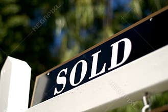 Sold sign in front of house or condo