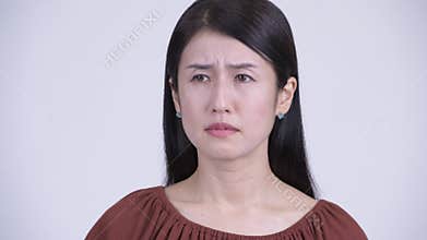 Face of sad Asian woman looking depressed and crying
