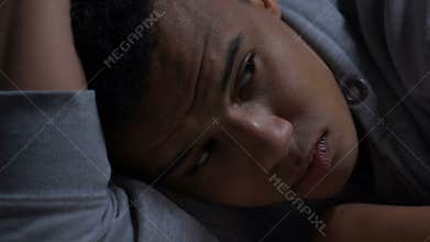 Depressed afro-american teenager thinking about life problems, mental health