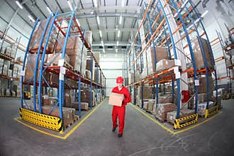 Worker in red uniform with box in warehouse