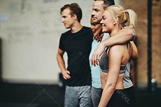 Diverse group of friends smiling together after a gym workout
