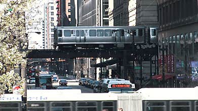 CHICAGO, ILLINOIS - April 30, 2015: Metro Train Passing And Traffic Street In Chicago Illinois Usa