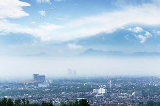 Wonderful Bandung cityscape with misty mountain