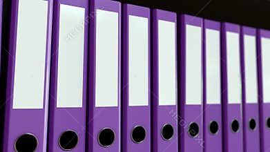 Multiple purple office binders