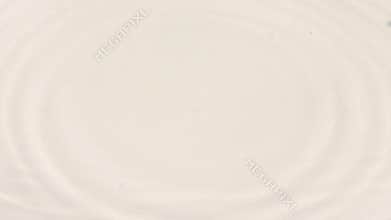 Fresh water drop on the surface of water in a white plate