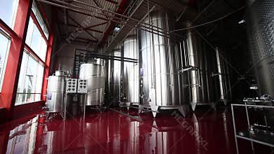 Wine tanks in winery, in motion