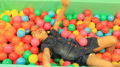 Children happiness emotion in colorful on ball pool