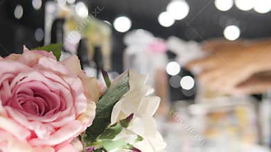 Woman Choosing Beauty Care Cosmetics in Fashion Shopping Mall. Blurred Female Customer Picking Body Gel Bottles in Shop
