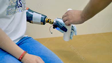 A disabled woman using robot-assisted bionic arm.