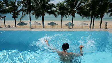 Man drowning in water at swimming pool. man drowning in the pool try to survive by put hand up asking for help