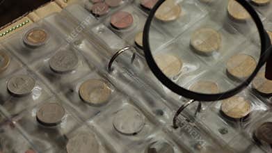 Numismatics concept. Collection of coins from different countries in album