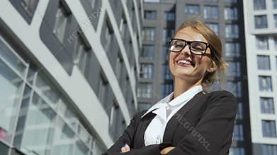 Successful businesswoman in front of corporation