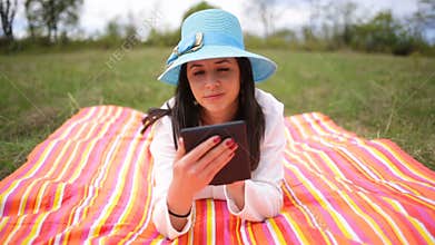 Attractive smiling young woman with e-book/tablet. Slide slider