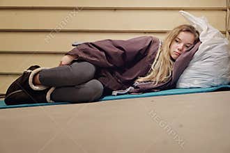 Homeless young teen taking shelter