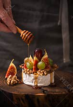Cooking dessert with camembert cheese, figs and honey