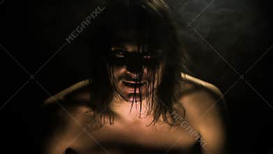 In the dark room the devil, a werewolf settles in a man.