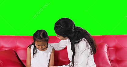 Mother giving advice to her guilty daughter