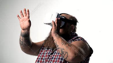 Fat bearded guy watching virtual reality device